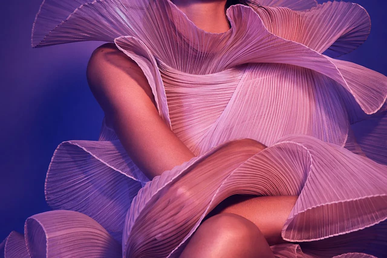 High-fashion model on a violet-lit editorial set